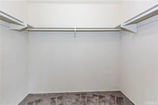 a view of hallway with wooden floor