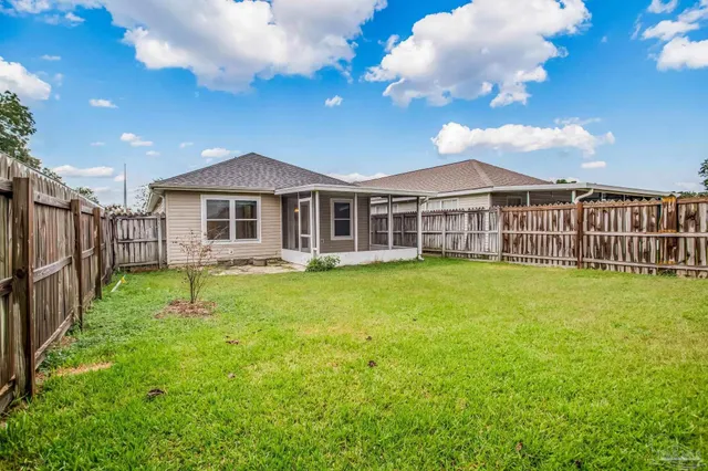 a view of a house with a yard