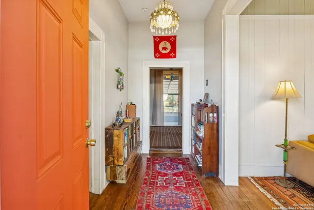 a view of an entryway with wooden floor