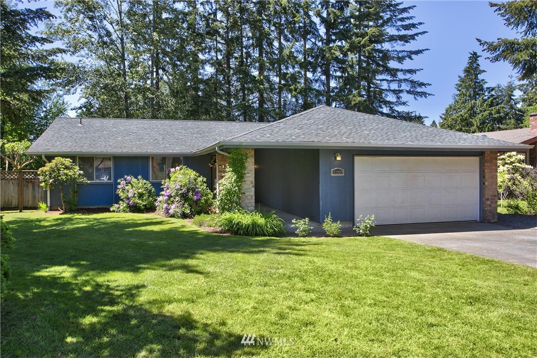 17322 24th Avenue Southeast Bothell, WA 98012 - Photo 1 of 24 a front view of a house with garden