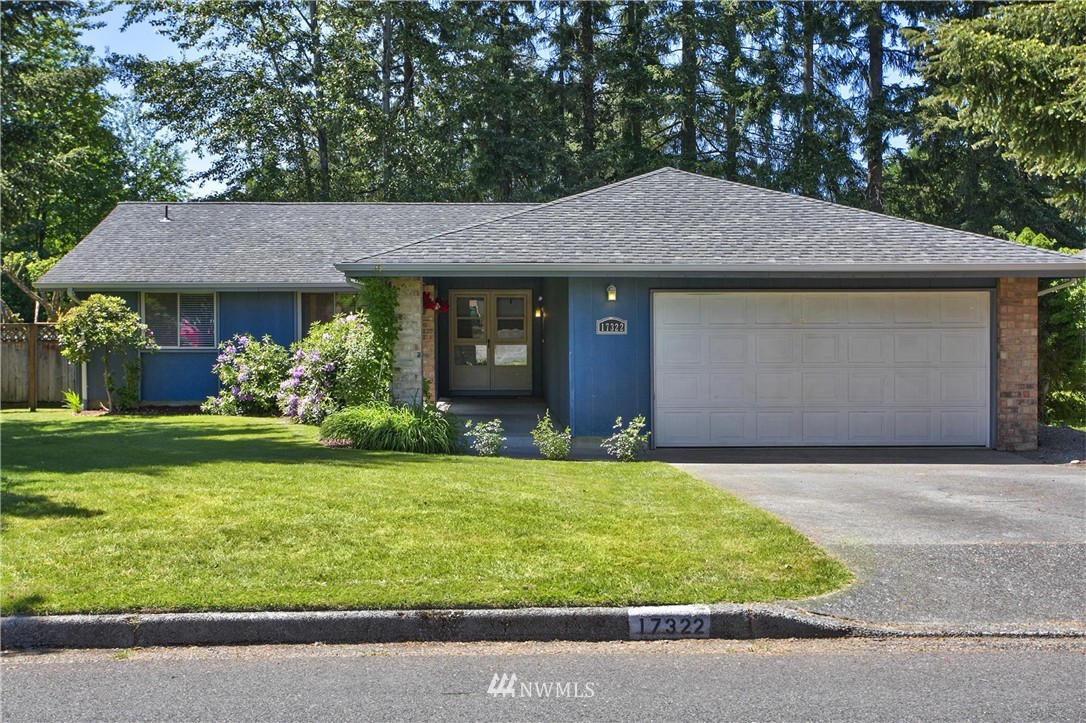 17322 24th Avenue Southeast Bothell, WA 98012 - Photo 2 of 24 a front view of a house with a yard and garage