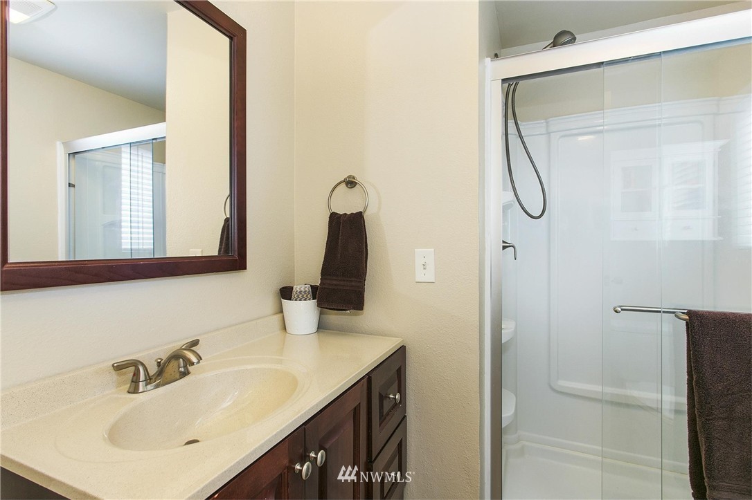17322 24th Avenue Southeast Bothell, WA 98012 - Photo 18 of 24 a bathroom with a sink and a mirror