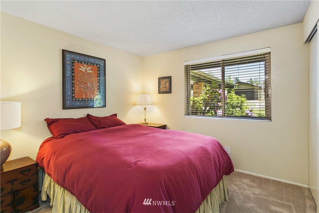 17322 24th Avenue Southeast Bothell, WA 98012 - Photo 19 of 24 a bedroom with a bed and a window