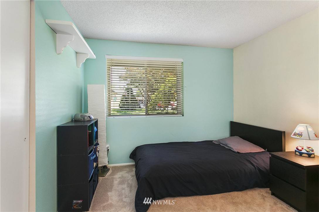 17322 24th Avenue Southeast Bothell, WA 98012 - Photo 20 of 24 a bedroom with a bed and a window