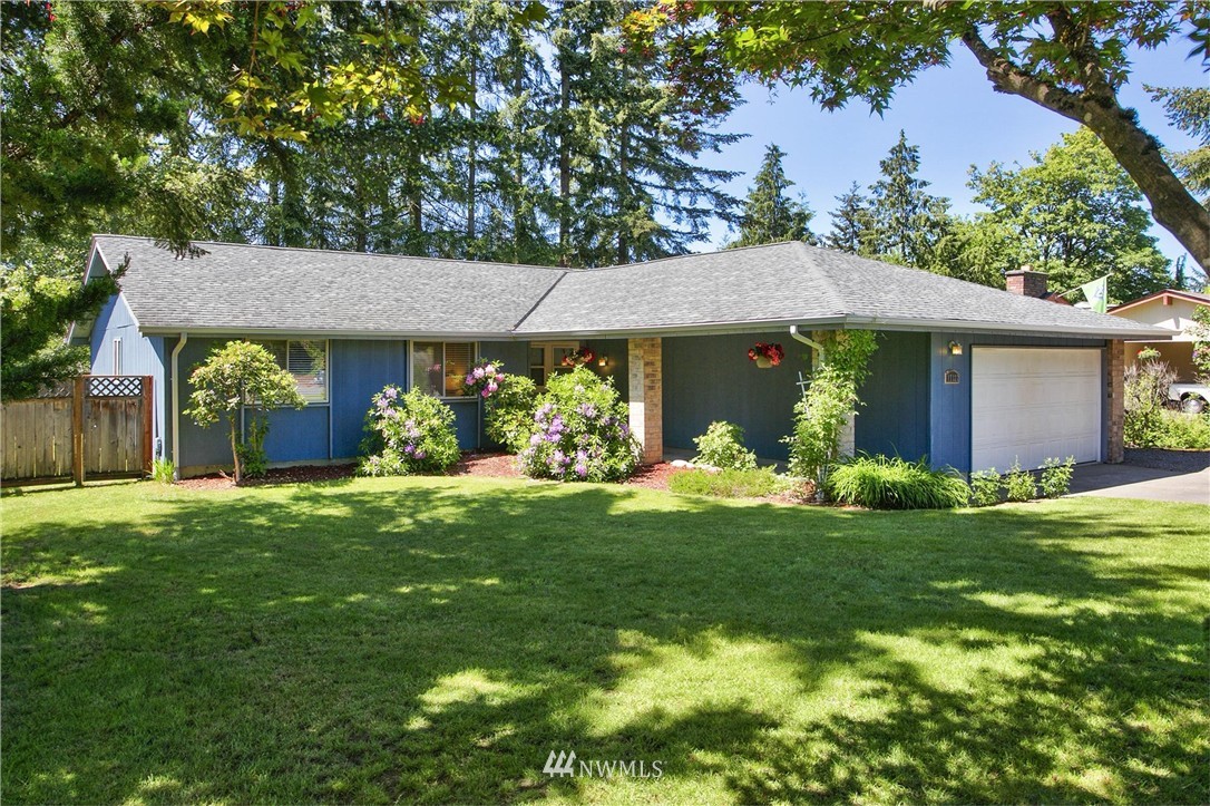 17322 24th Avenue Southeast Bothell, WA 98012 - Photo 3 of 24 a front view of a house with garden