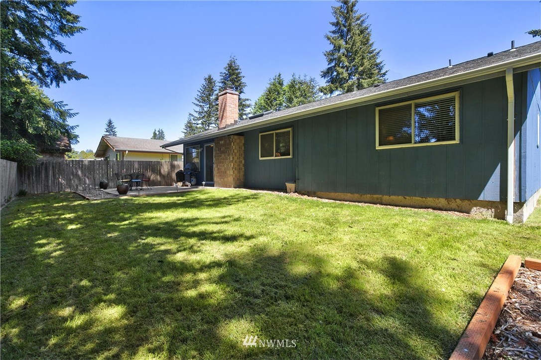 17322 24th Avenue Southeast Bothell, WA 98012 - Photo 24 of 24 a backyard of a house with lots of green space