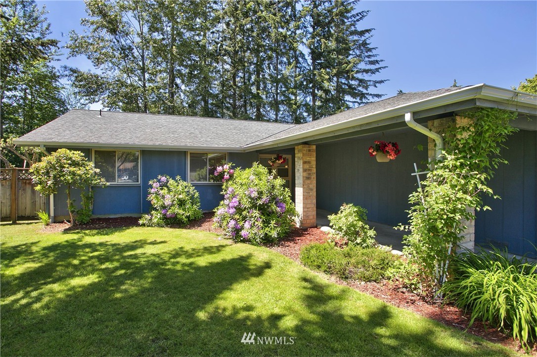 17322 24th Avenue Southeast Bothell, WA 98012 - Photo 4 of 24 a front view of a house with a yard