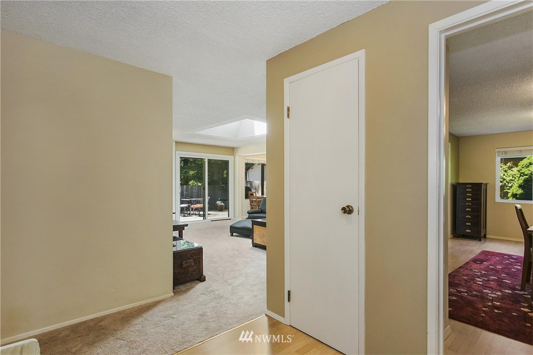 17322 24th Avenue Southeast Bothell, WA 98012 - Photo 6 of 24 a view of a hallway with wooden floor and a bedroom