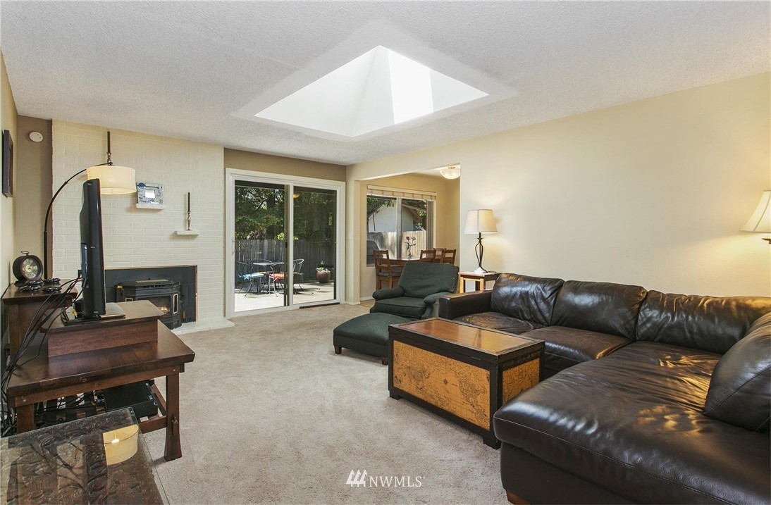 17322 24th Avenue Southeast Bothell, WA 98012 - Photo 8 of 24 a living room with furniture and a flat screen tv