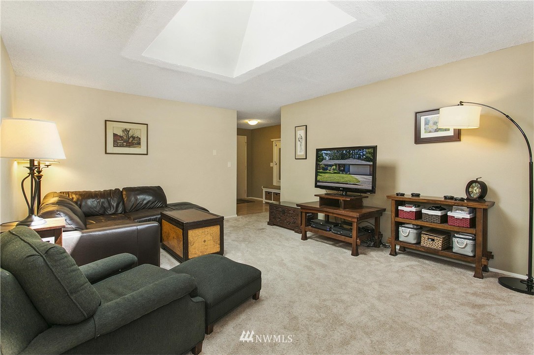 17322 24th Avenue Southeast Bothell, WA 98012 - Photo 9 of 24 a living room with furniture and a flat screen tv