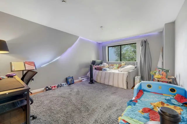 a bedroom with toys and a couch
