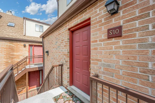 a view of a brick building with large windows