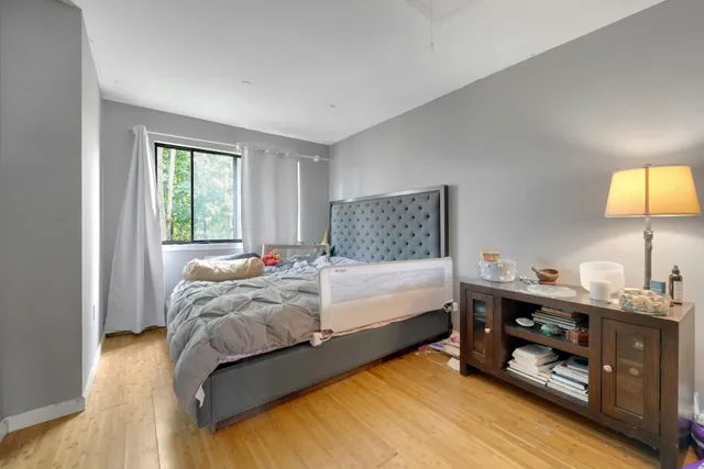 a bedroom with a bed and a tv