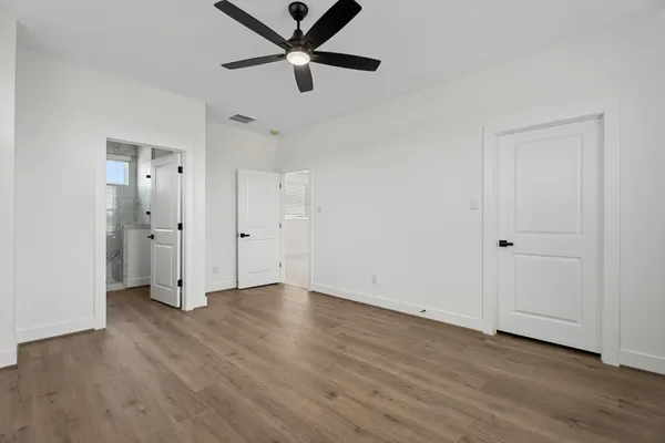a bathroom with a double vanity sink mirror and shower
