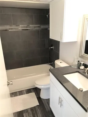 a view of hallway with wooden floor