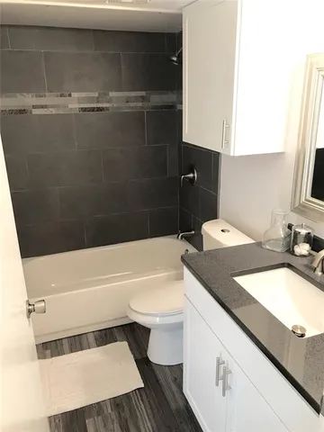 a view of hallway with wooden floor