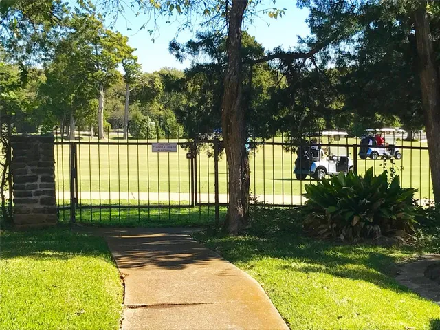 a front view of a house with a yard and outdoor seating