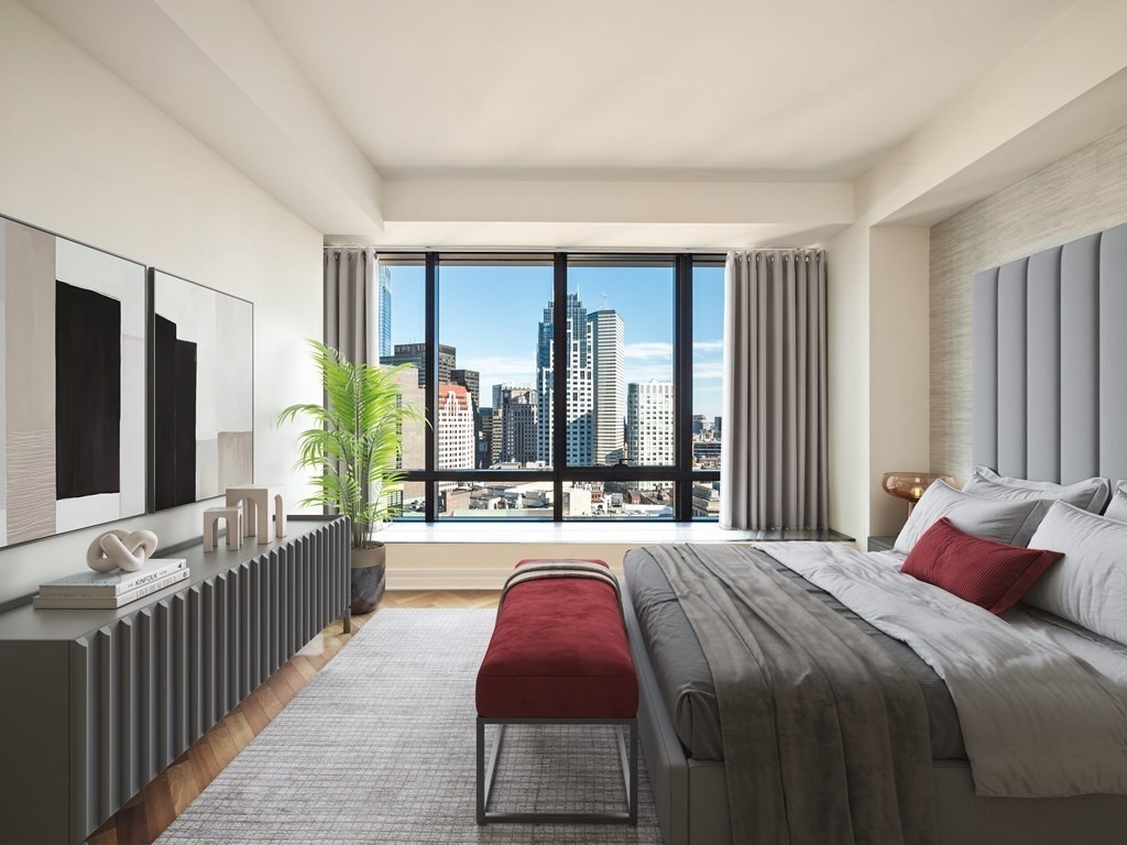 2 Avery Street, Unit 22G Boston, MA 02111 - Photo 13 of 28 a bedroom with a large bed and a large window