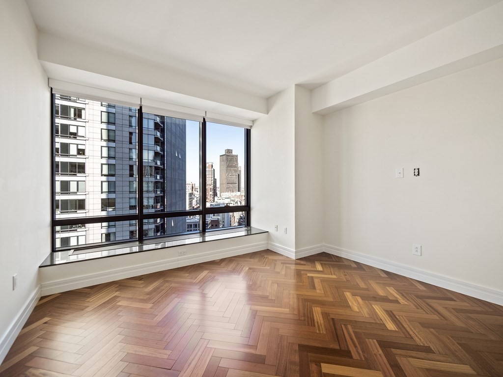 2 Avery Street, Unit 22G Boston, MA 02111 - Photo 18 of 28 a view of an empty room with a window