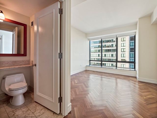 a living room with fireplace furniture and a chandelier