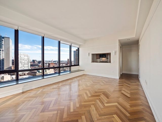 a view of an empty room and window