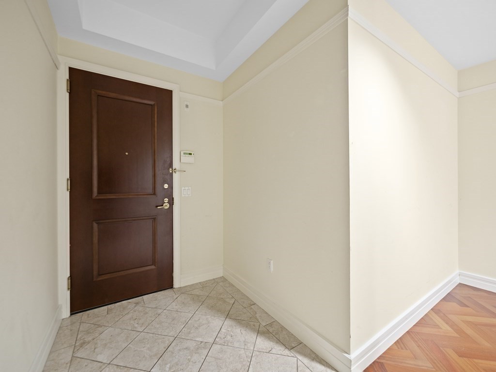 2 Avery Street, Unit 22G Boston, MA 02111 - Photo 10 of 28 a view of hallway with closet and cabinet