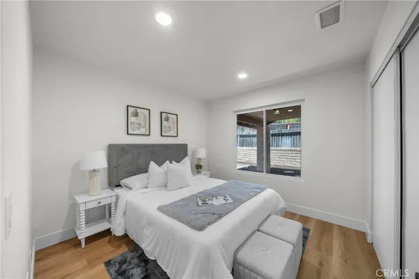 a bedroom with a bed and a window