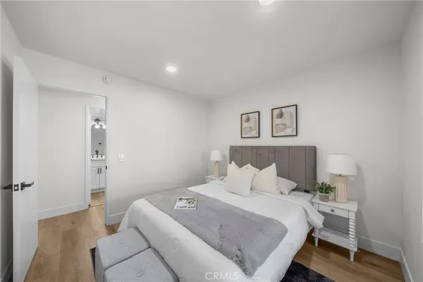 a bedroom with a bed and a couch