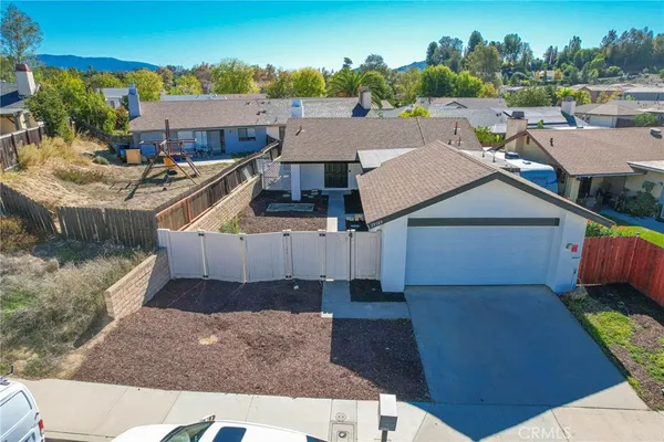 an aerial view of a house with a garden