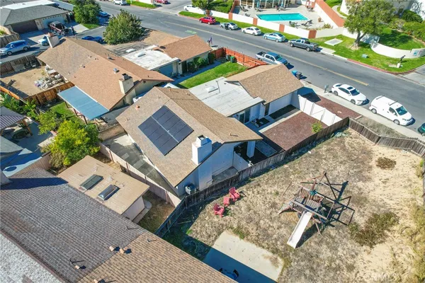 an aerial view of a house with a garden