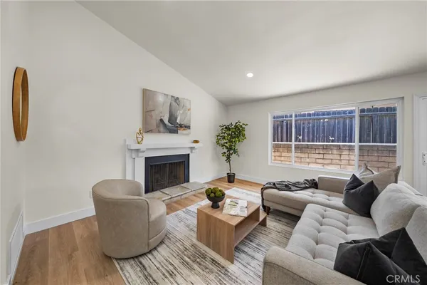 a living room with furniture and a fireplace