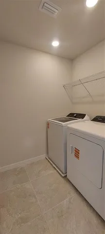 a bathroom with a double vanity sink and mirror