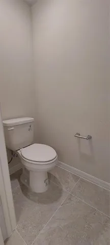 an empty room that has a window in it