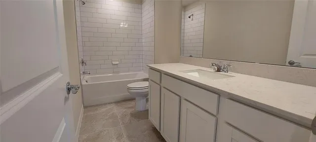 an aerial view of a house with swimming pool and outdoor seating