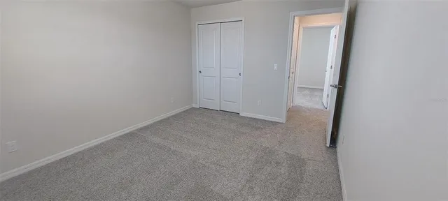an aerial view of a house with a yard lake lake view and mountain view
