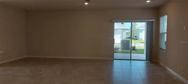 a kitchen with stainless steel appliances granite countertop a refrigerator sink and cabinets