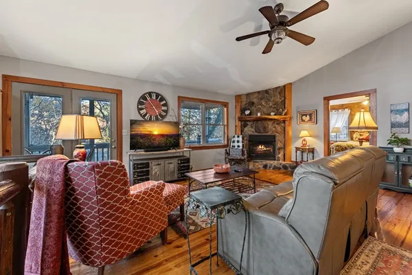 a living room with furniture and stairs
