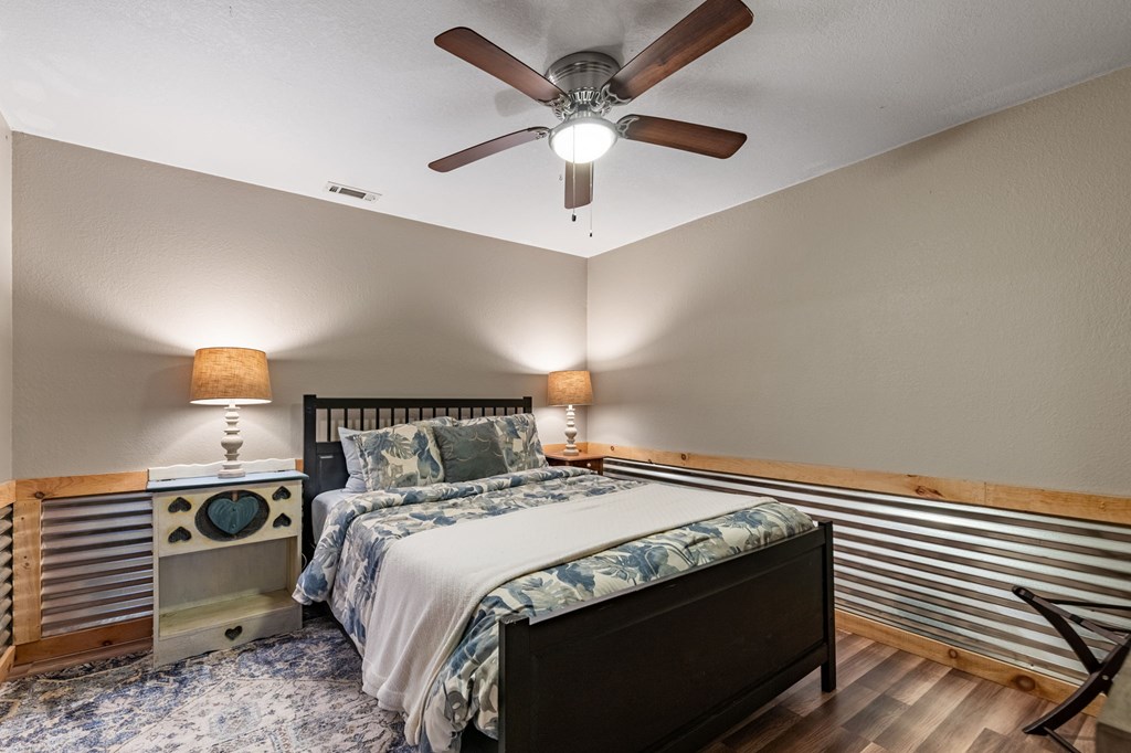 90 Hay Lane Morganton, GA 30560 - Photo 37 of 77 a bed sitting in a bedroom next to a lamp