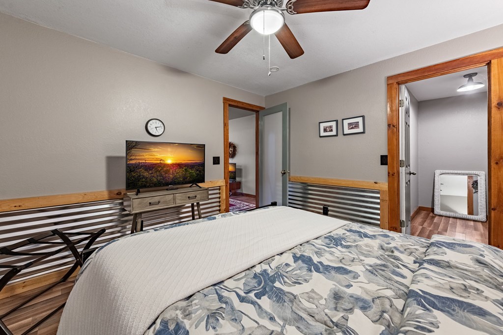 90 Hay Lane Morganton, GA 30560 - Photo 38 of 77 a bedroom with a bed and a flat screen tv