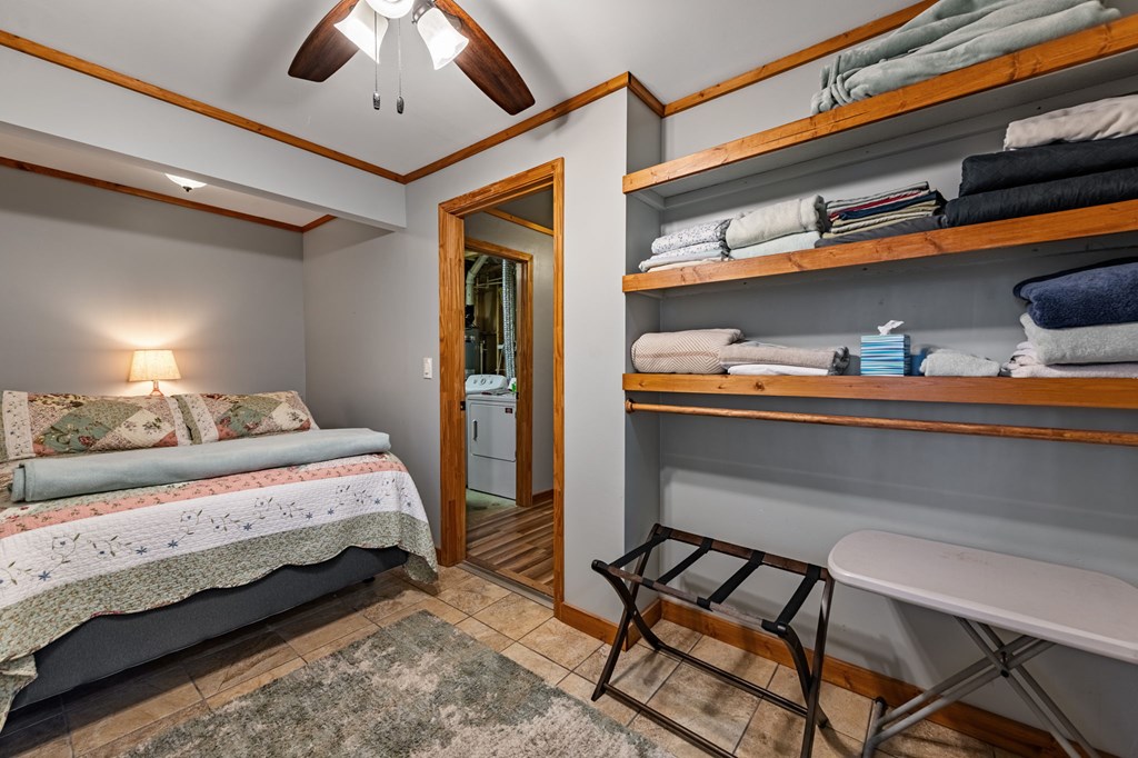 90 Hay Lane Morganton, GA 30560 - Photo 44 of 77 a bedroom with a bed and a lamp with the dresser