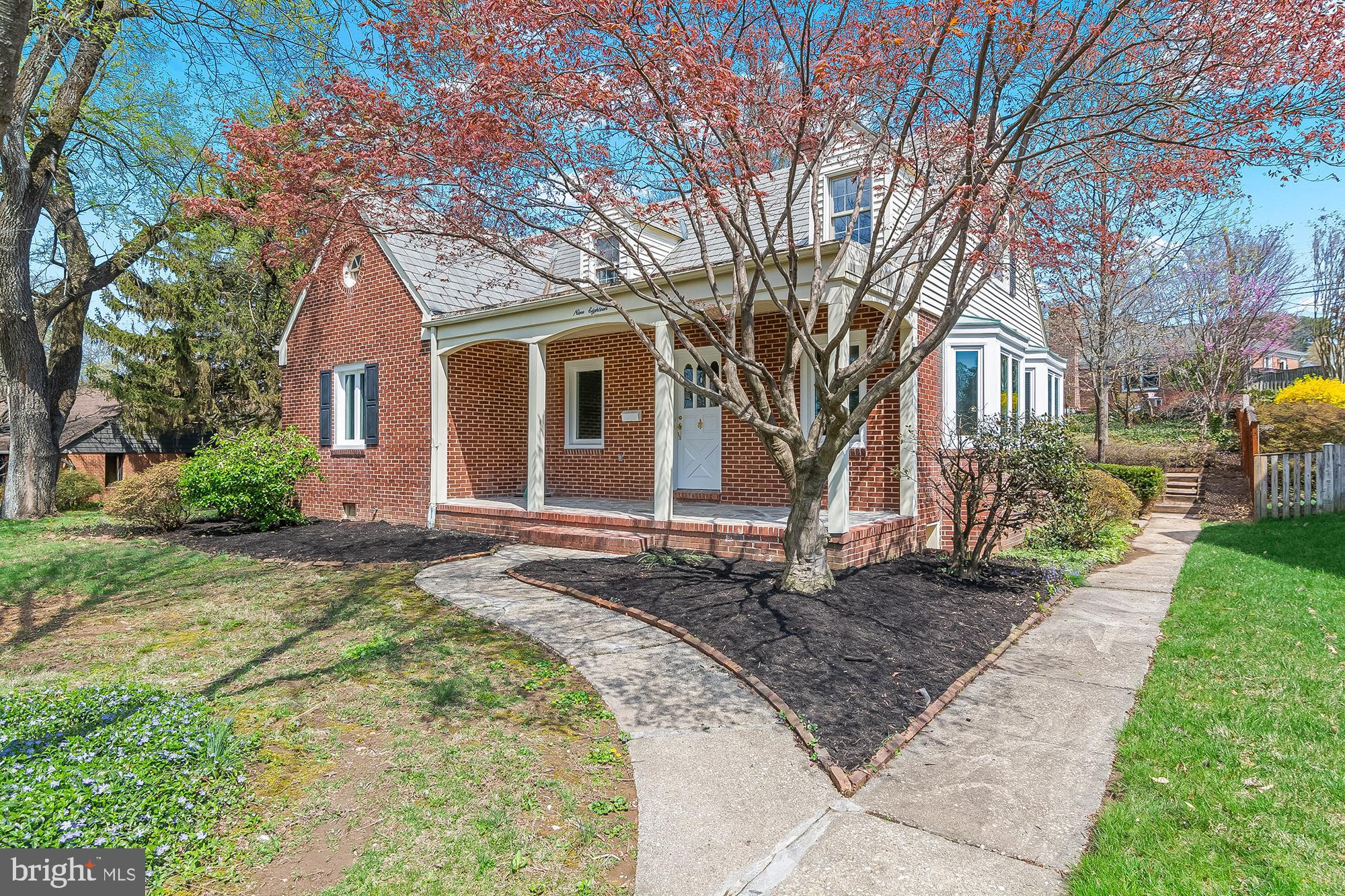 918 Weatherbee Road Baltimore, MD 21286 - Photo 4 of 59 a front view of a house with a garden