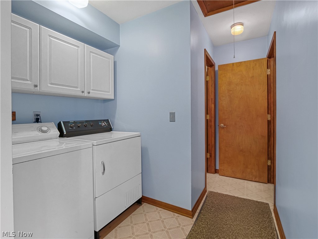 5175 Case Road North Ridgeville, OH 44039 - Photo 21 of 28 Clothes washing area featuring independent washer and dryer, cabinets, and light tile floors