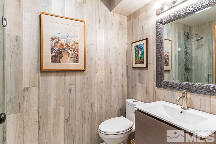 4075 Ramrod Circle Reno, NV 89519 - Photo 17 of 24 a bathroom with a toilet sink and mirror