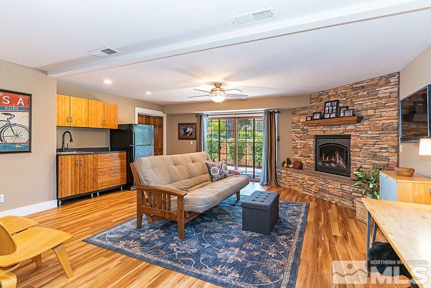 4075 Ramrod Circle Reno, NV 89519 - Photo 18 of 24 a living room with furniture fireplace and flat screen tv
