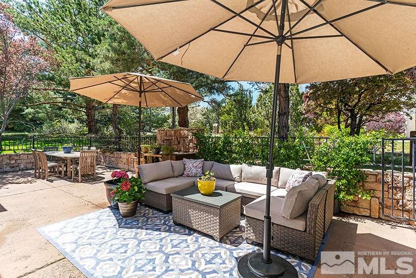 4075 Ramrod Circle Reno, NV 89519 - Photo 19 of 24 a view of a tables and chairs under an umbrella