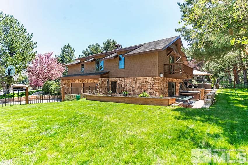 4075 Ramrod Circle Reno, NV 89519 - Photo 21 of 24 a view of a house with a yard porch and sitting area