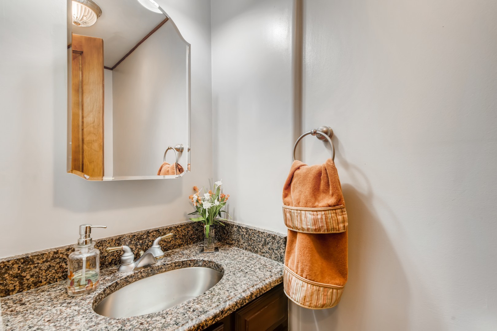 300 Blythe Road Riverside, IL 60546 - Photo 14 of 31 a bathroom with a sink and a mirror