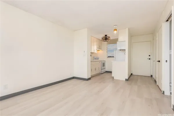 wooden floor in an empty room and kitchen