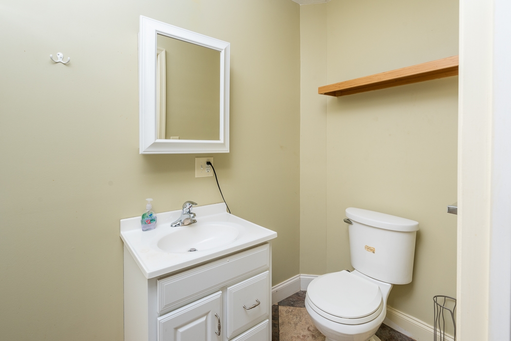 2161 Middlebrook Road Staunton, VA 24401 - Photo 27 of 75 a bathroom with a sink a toilet and mirror