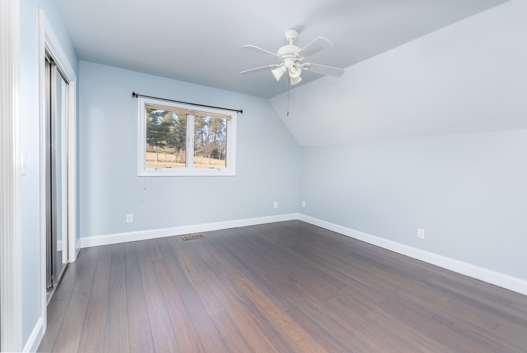 2161 Middlebrook Road Staunton, VA 24401 - Photo 48 of 75 a view of an empty room with wooden floor and a window